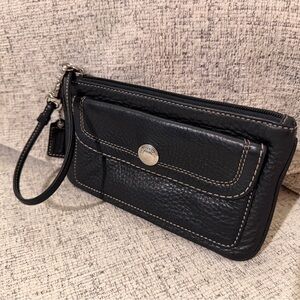 Coach Black Pebbled Leather Wristlet with flap snap closure and hangtag.7.5x4.5